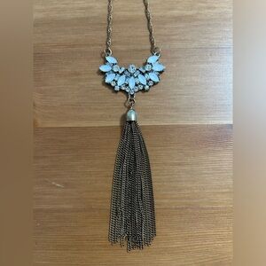 Long rhinestone embellished necklace with tassel with bronze finish